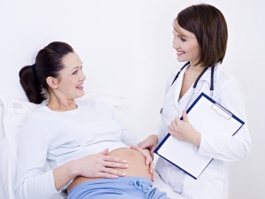 doctor talks with pregnant woman