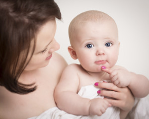 Baby Boy Holding On To Mothers Finger